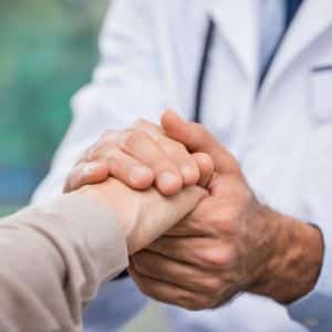 doctor and patient shaking hands