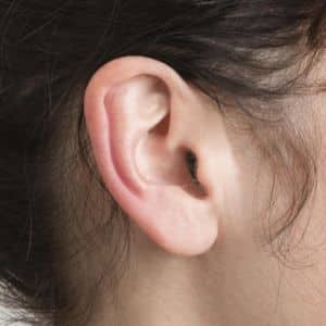 close up of someone wearing a hearing aid