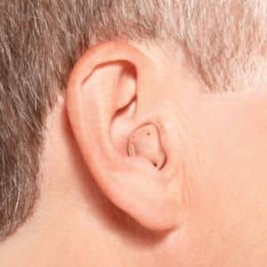 close up of someone wearing a hearing aid