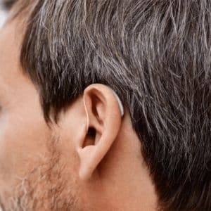 close up of someone wearing a hearing aid