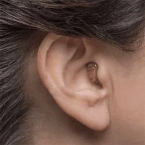 close up of someone wearing a hearing aid