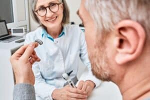 audiologist smiling at patient