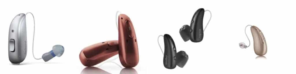 4 different brands of hearing aids sitting in a row